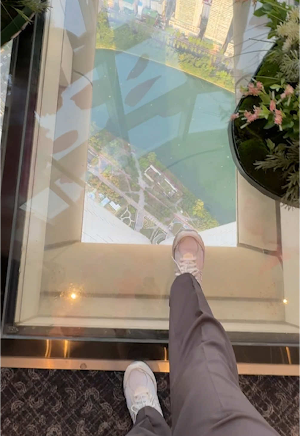 A post by @tuonto on TikTok caption: jumping on a glass floor.. #tuonto #korea #travel 