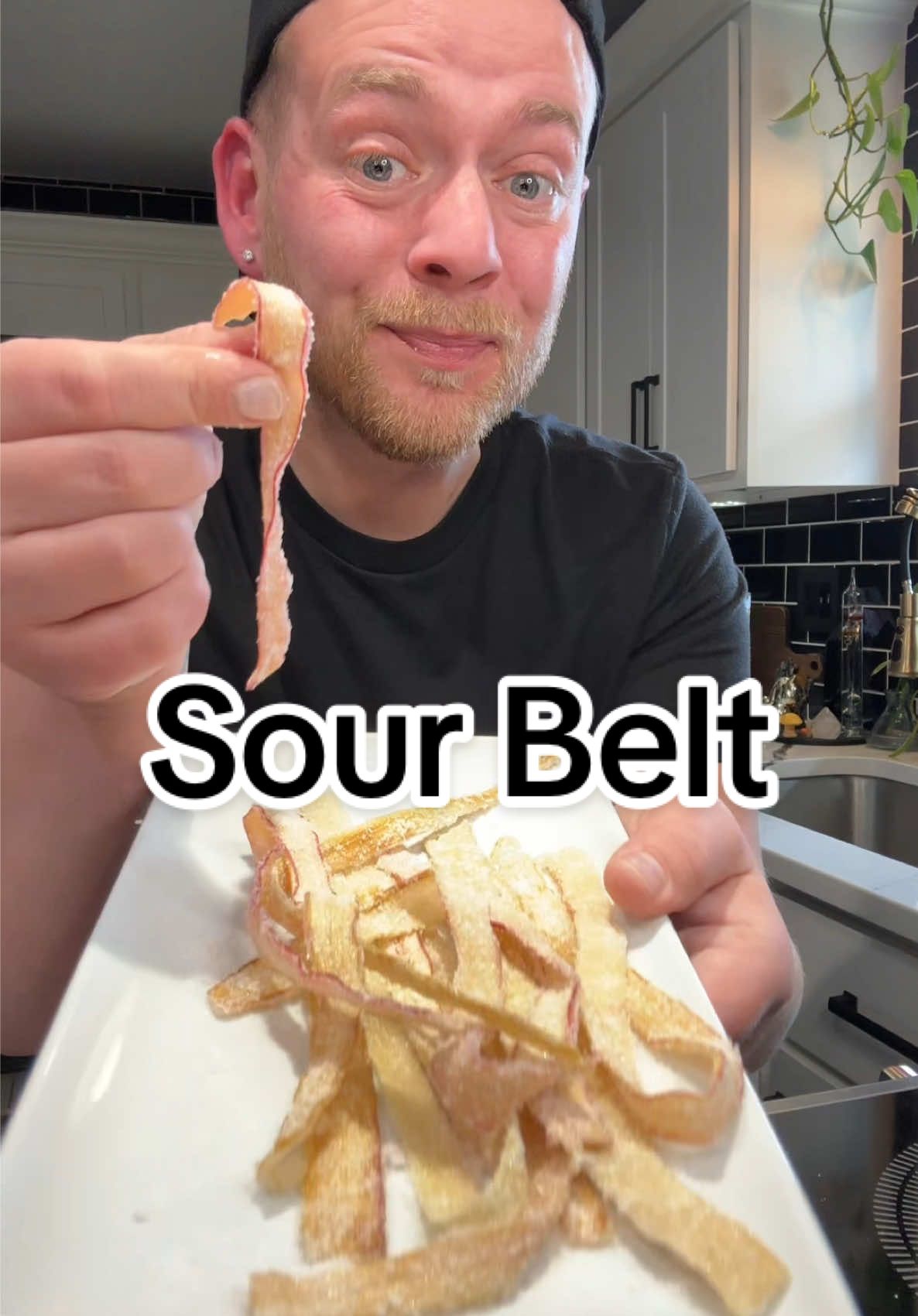 A post by @kitchentool on TikTok caption: Homemade Sour Belt Candy is a useful way to use that last few rhubarbs 😁  #homemadesourbelt  #homemadecandy #homemade #sourbelt #sour #candy #easyrecipe #tryit #fyp 