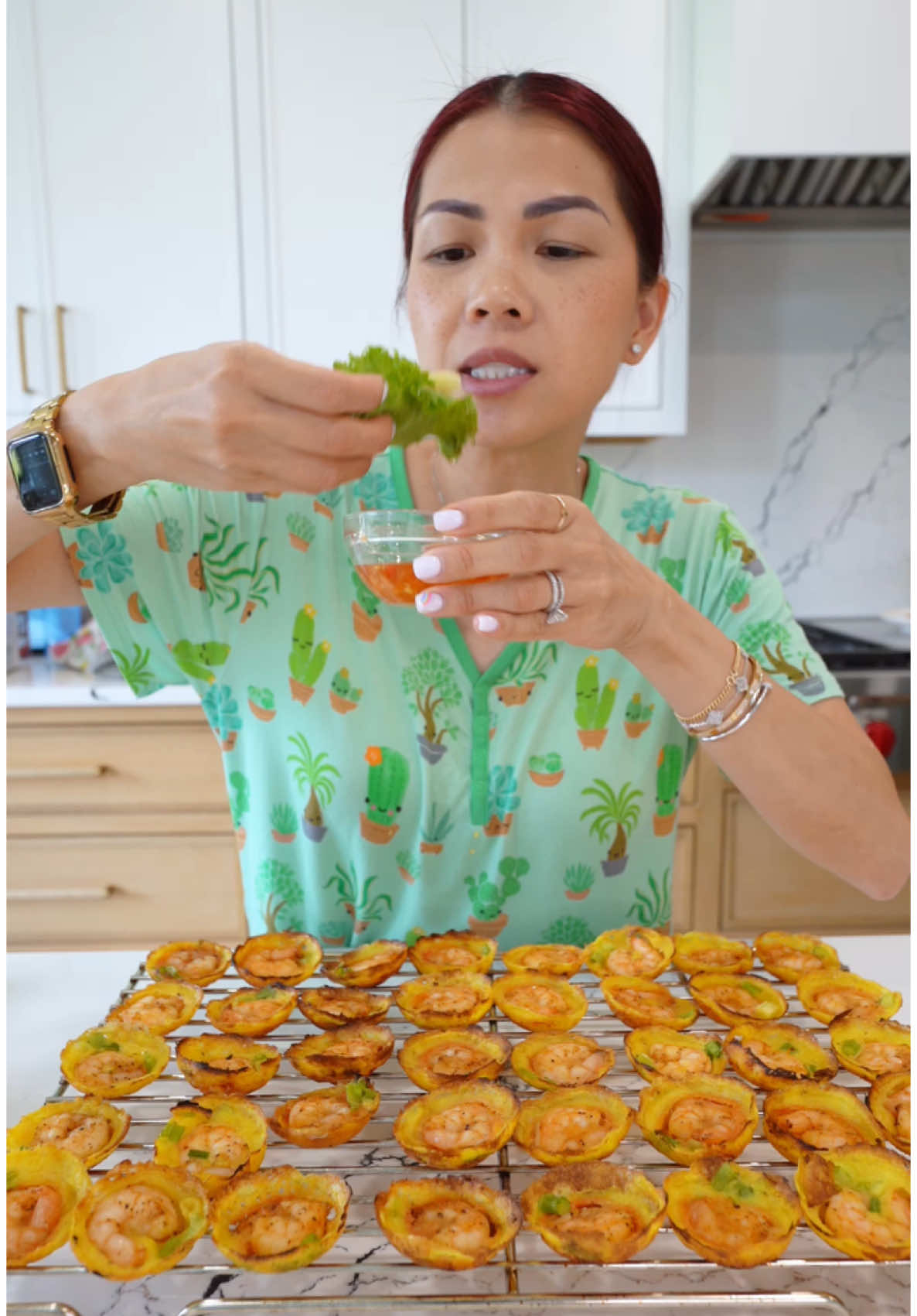 A post by @alissanguyen_ on TikTok caption: If you can’t get pre mixed batter, you can make it! SHRIMP BANH KHOT BATTER: 1¾ cup rice flour ¾ cup all purpose flour 1 TBSP turmeric 3 ½ cups water 1 can (14 oz coconut milk) 1 egg 1-2 TBSP oil 1 tsp salt Chopped scallion (optional)   SHRIMP 2 lb shrimp 1 tsp paprika 1 tsp garlic powder ½ tsp salt ½ tsp black pepper 1 TBSP olive oil   ADDITIONAL INGREDIENTS Oil for cooking Lettuce and herbs for serving   1.        Combine all of yoru ingredients listed under batter. Let this sit for at least 10 minutes so the batter blooms.   2.        Wash shrimp and pat dry. Then season shrimp with: paprika, garlic powder, salt, black pepper and olive oil.   3.        When you are ready to cook, you will need an aebleskiver plan. On medium high heat, add some oil to east slot and drop a shrimp into each slot. Then fill each slot up with some BATTER (tip: do not pour batter directly over shrimp. Instead, pour on the side so batter drips UNDER the shrimp. Lert this cook for 4-6 minutes or until bottom is crispy.   4.        Option: after 4-6 minutes, flip banh khot over and cook on the other side for 1-2 minutes.   5.        Remove banh khot and enjoy as a lettuce wrap dipped in FISH SAUCE. You can add scallion oil over the top of each banh khot but I did not do that.     FISH SAUCE 1 can coco rico (or 12 oz of water) 2 TBSP minced garlic ¼ cup sugar ¼ cup fish sauce 2 TBSP sambal chili paste -              Mix this all together. Adjust if needed.