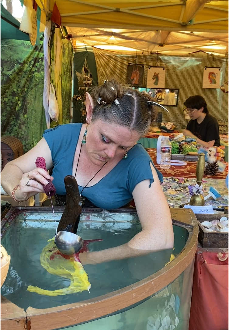 A post by @sher_leas on TikTok caption: Beautiful dragon candle made by my beautiful momma. What a wonderful weekend filled with lively people. Can’t wait for next weekend. It’s supposed to be a lot less hot so that will be nice! #dragon #candle #magic #MAGIC #faire #rennaissance #festival #amazing #wow #hot #sweaty #woman 