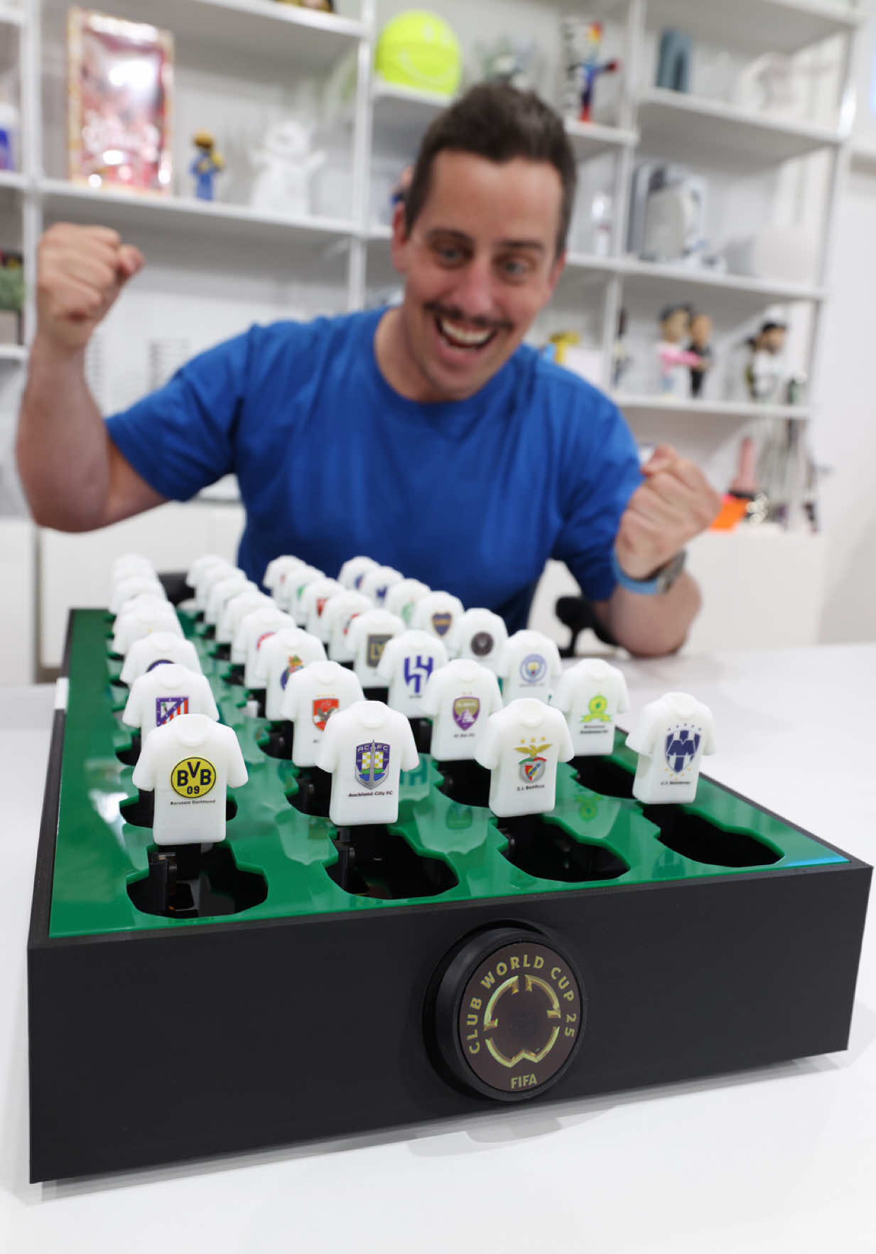 A post by @unnecessaryinventions on TikTok caption: The Dream Team Generator™️ Helping new football fans pick their go to team for the @FIFAClubWorldCup in an instant. This one of a kind device features all 32 Teams competing in the tournament. With our signature randomization algorithm, each team will fall one by one until you are left with one team standing for you to root for to take home the trophy. #fifapartner #FCWC #TakeItToTheWorld