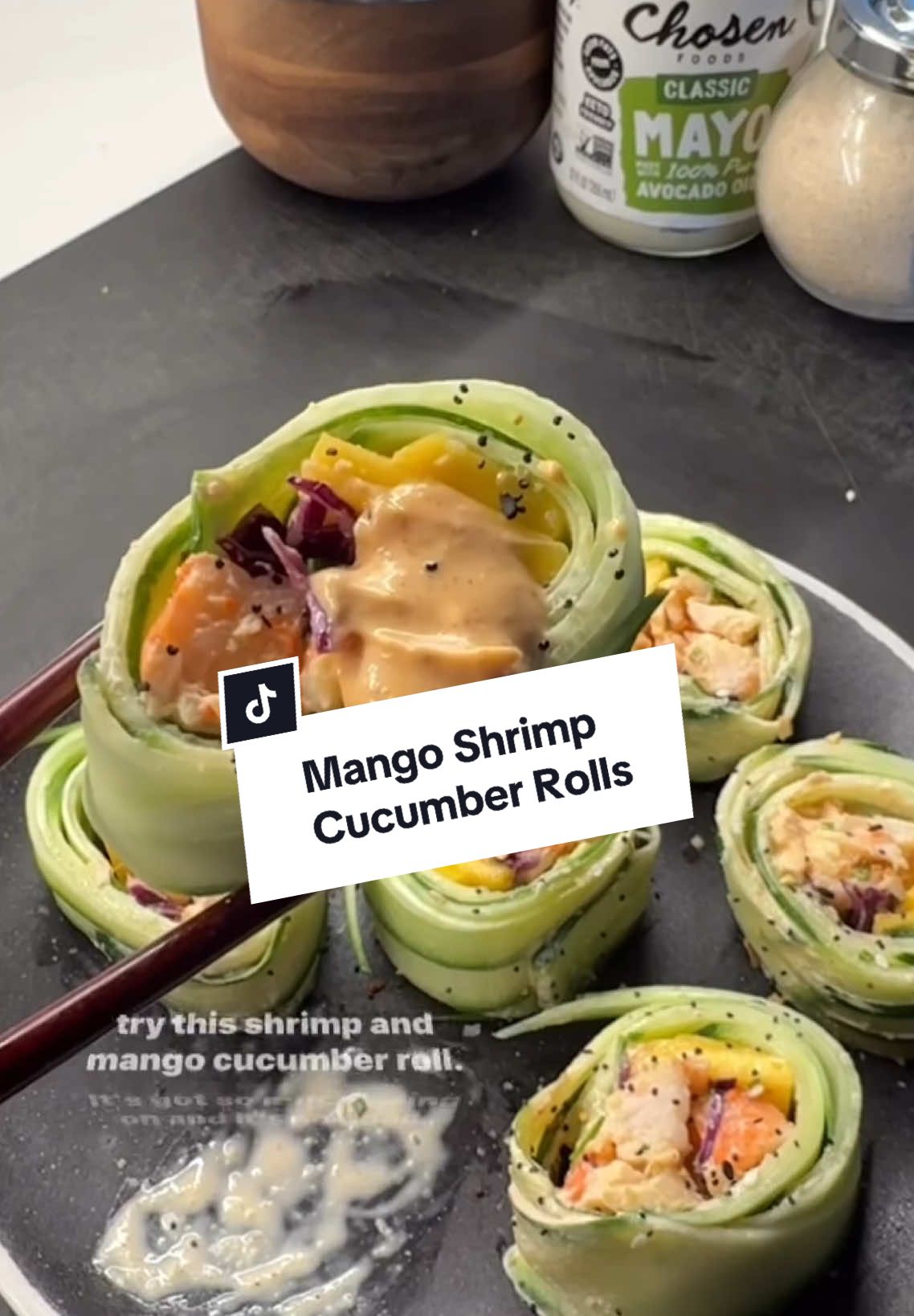 A post by @ketorecipes on TikTok caption: 🥭MANGO SHRIMP CUCUMBER ROLL If you’re looking for a ridiculously good high protein lunch, you’ve got to try this mango shrimp cucumber roll - its a a little sweet, a little salty, creamy, crunchy, and so good. I started by making a delicious shrimp salad with the most amazing sauce. I mixed mayo with sriracha, onion powder, garlic powder, & chipotle powder, some fresh lime juice, and it was the most perfect pairing with the shrimp + mango. Here is how to make the shrimp salad: 1. In a mixing bowl mix 3 tbsp mayo, 1 tbsp sriracha, juice of half a small lime, a pinch of salt, ¼ tsp garlic powder, ¼ tsp onion powder, & ¼ tsp chipotle powder. Add a generous pinch of salt, mix well, taste, & adjust. Save 1 tbsp of sauce for later. 2. Grab ½ lb cooked, peeled & deveined shrimp. Roughly chop into ¼ inch pieces. Add it to the bowl. 3. Add 2 tbsp super finely diced shallot or red onion, 2 tbsp finely diced chives, Mix well. 4. You can eat this on its own, in bread, a lettuce wrap—or roll it up in cucumbers like I did. Here is how to roll it up: 1. Thinly slice a large English cucumber using a peeler. 2. Lay slices on parchment paper, slightly overlapping by about 1/3. 3. Pat the cucumber dry with a paper towel. 4. Add 3-4oz of the shrimp salad about 2 inches from the bottom, leaving space on all sides. Top with thin mango slices, super thinly shredded cabbage, & fresh chives. Spread leftover sauce at the top. 5. Roll it up nice and tight. Start from the bottom, fold over the toppings, and continue to roll carefully, pressing down to pack it nice and tight. 6. Slice the roll with a sharp knife, then top with everything bagel seasoning and serve with more sauce if you like. If you make it, be sure to let me know what you think on SHREDHAPPENS! . . . #highprotein #lowcarb #healthyrecipes #healthyfoodshare #cucumberroll #whatsonmyplate #lơwcarbrecipes