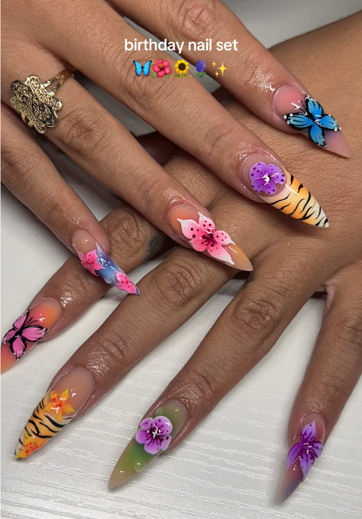 A post by @paige_mariah on TikTok caption: 💅🏼💅🏼💅🏼 #newnails #3dnailart #butterflynails #3dflowersnails 