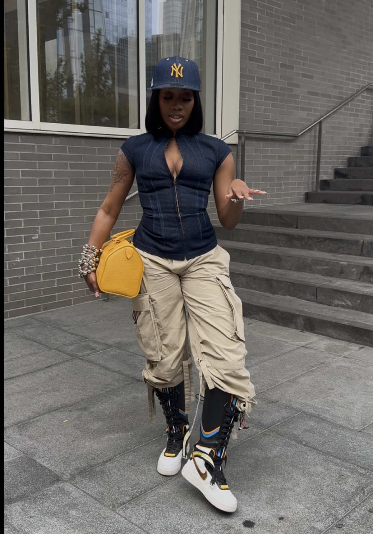 A post by @fashionnprodigy on TikTok caption: Replying to @Shec i’ve gotten so many compliments on this denim hat from both men + women I wasn’t aware how “different” it was lol. Pairing it with this denim spiked top was just chef’s kiss! One of my favorite recent casual fits.. Do we love? #fashion #fyp #outfitinspo 