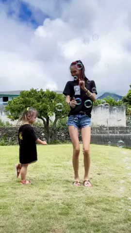 A post by @kimcheesaay on TikTok caption: ‘Mommy I got a flower for you.”🥹  Spending time outside + Bubbles💛🫧 #fyp #foryoupage #motherdaughter #toddlermom #momoftiktok 