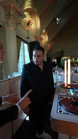 A post by @djnickspinelli on TikTok caption: Multitasking while playing the hits before salad is served 😅 