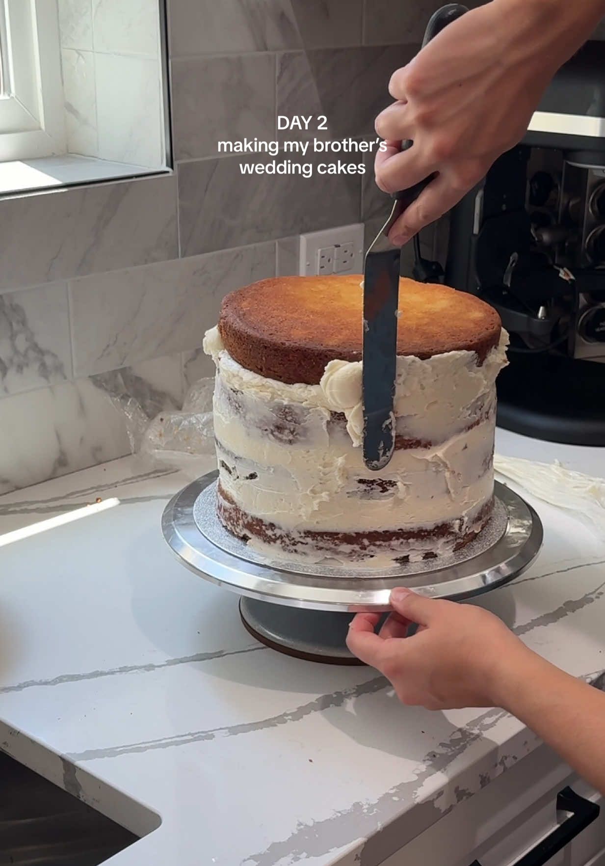 A post by @zoebarriesode on TikTok caption: DAY 2: making my brother’s wedding cakes (he requested a naked cake for their main wedding cake) 🫡  #wedding #weddingcake #baking #cakes #weddingtiktok 