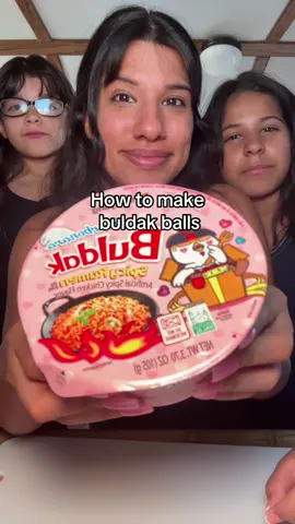 A post by @arimonika on TikTok caption: How to make buldak balls 👩🏽‍🍳🩴#ramenballs #buldakballsrecipe #imyourmomnow #hotcheetodust #buldakramennoodles #buldakramenballs #buldakballrecipe #howtomakebuldakballs #sahm #family #kidrecipes 