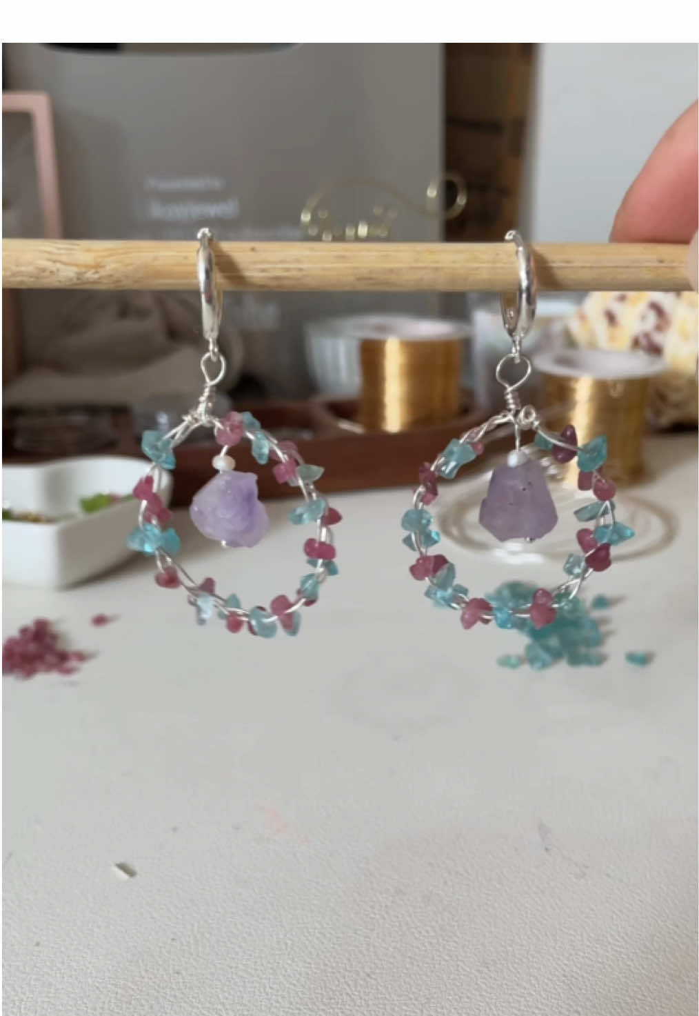 A post by @likayjewel_diylilylin on TikTok caption: Pink tourmaline and blue apatite garland with amethyst center earrings #handmadejewelry #earrings #earringslovers #earringmaking #handmadeearrings #uniqueearrings #tutorial #foru 