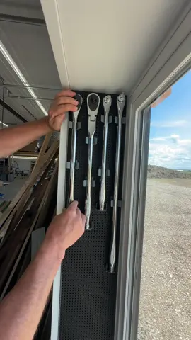 A post by @dustylumberco on TikTok caption: Decided to try out lining the window jambs with @Toolgrid panels and then hanging all the @Milwaukee Tools ratchets and extensions.  