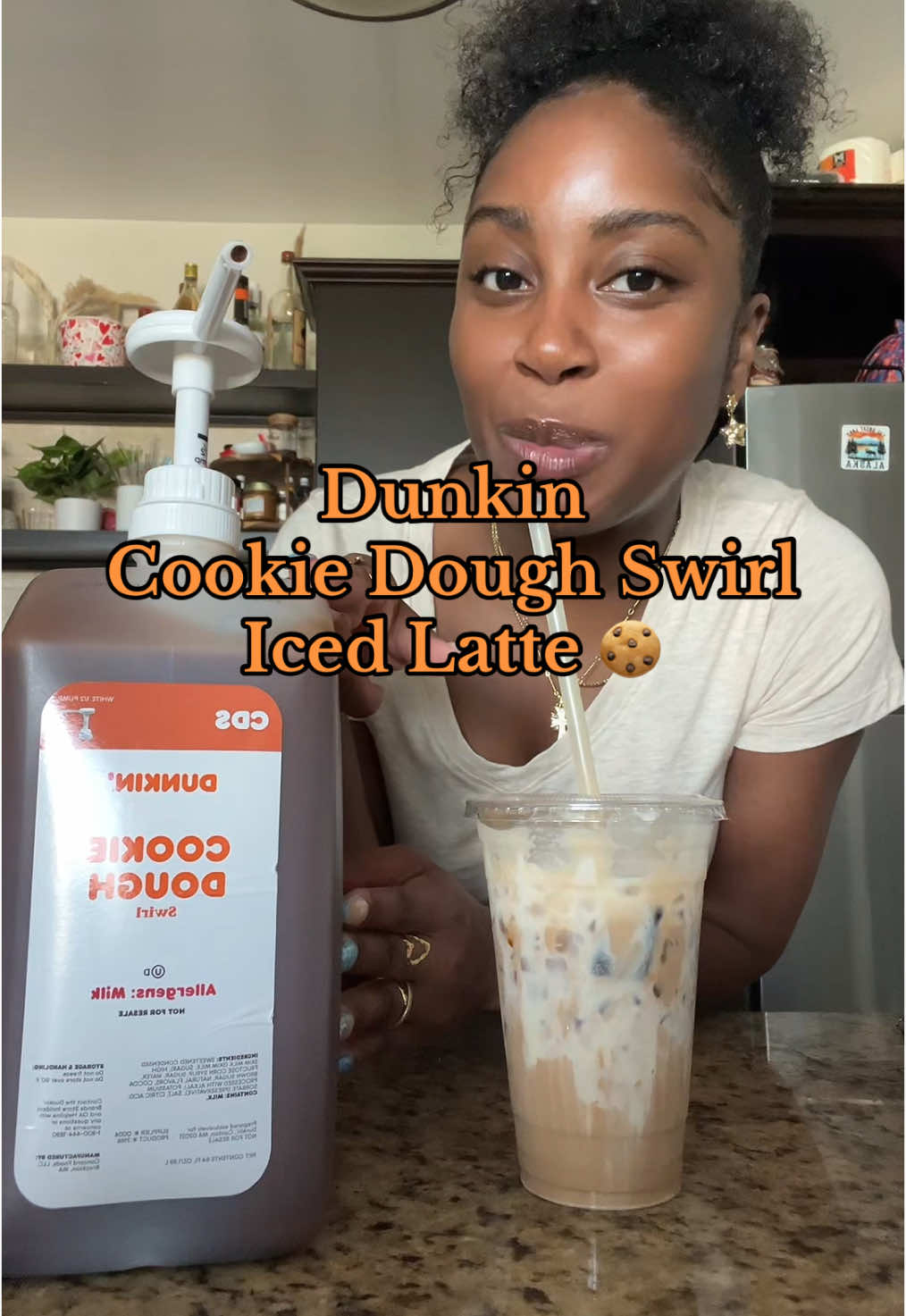 A post by @kmaeleee on TikTok caption: dunkin cookie dough iced coffee at home!!! #icedcoffeeathome #cookiedoughswirl #dunkin #dunkincoffee 