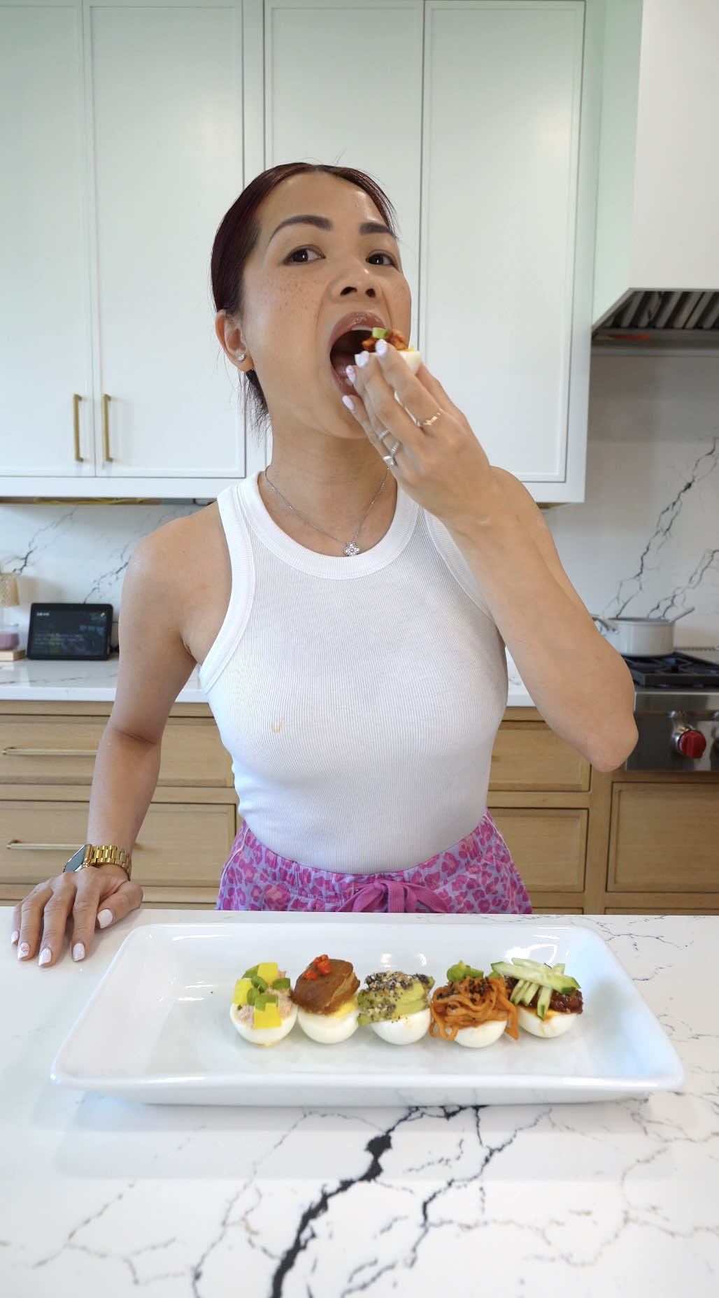 A post by @alissanguyen_ on TikTok caption: 6 eggs, 6 ways 1. Pickled garlic with scallion garnish  2. Tuna, mayo, sriracha, pickled radish and scallion 3. Thit kho / caramelized pork 4. Avocado and everything but bagel seasoning egg 5. Spicy noodles/ buldak noodles 6. Korean soybean paste (ssamjang) with cucumber  