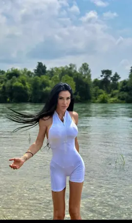 A post by @yelena_infernalfit on TikTok caption: “Anche in bianco resto una regina infernale 👑🔥🖤” Jumpsuite @yogamma store 