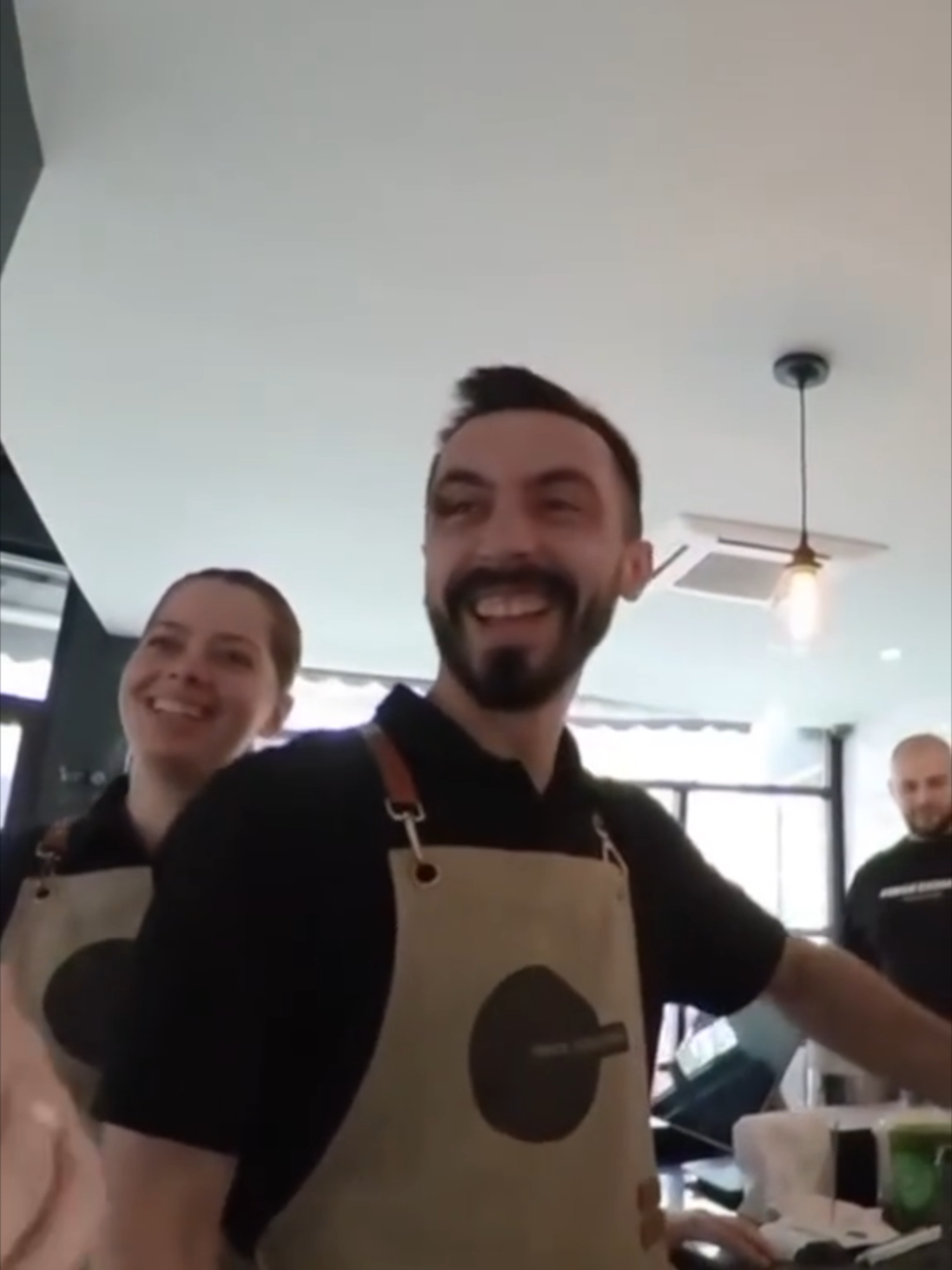 A post by @xiaomanyc on TikTok caption: They think I'm Albanian when ordering coffee