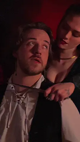 A post by @calebthebard on TikTok caption: @Betty 💕 Some bardic fun with my lady friend #dnd #bard #couplestiktok #captivated #bookish 