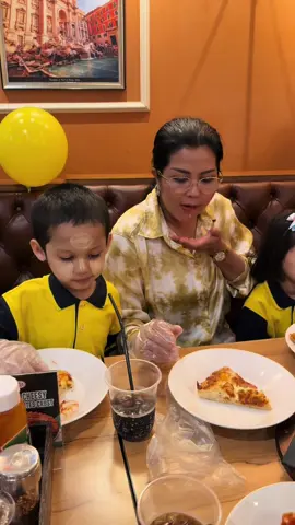 A post by @khinehninwai19 on TikTok caption: ဖိနပ်လိုက်ဝယ်ပေးရင်း မုန့် စား💚💙