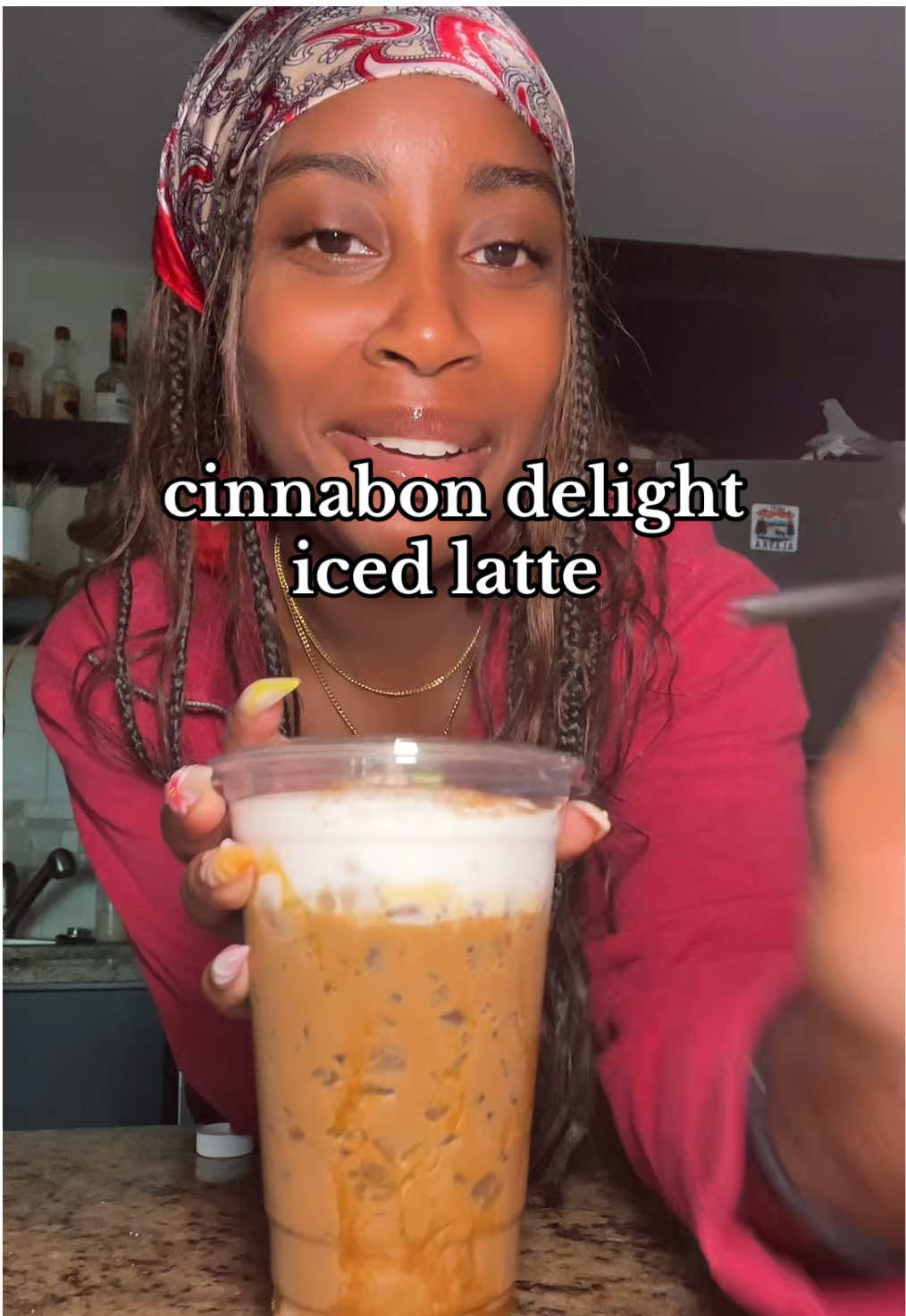 A post by @kmaeleee on TikTok caption: making a Cinnabon delight iced latte inspired by the Taco Bell cinnabon iced coffee!!  thank you for sending over the syrup @Danielle 🫶🏾🫶🏾 #icedcoffee #icedcoffeeathome #icedcoffeerecipe #cinnabondelights #cinnaboncoffee 