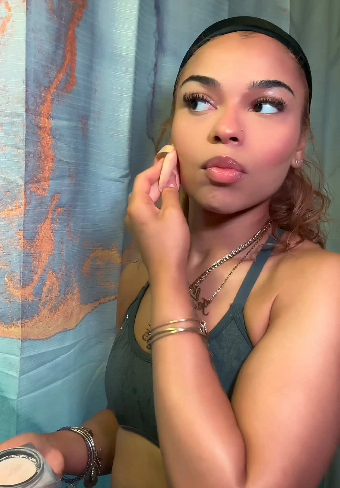 A post by @_iiamjvs on TikTok caption: Summer glow enhancements 🩷 #fyp #makeup #summermakeup #beauty @Huda Beauty @Fenty Beauty @makeupbymario @Hourglass Cosmetics @LYS Beauty @Rare Beauty @Benefit Cosmetics @elfcosmetics 