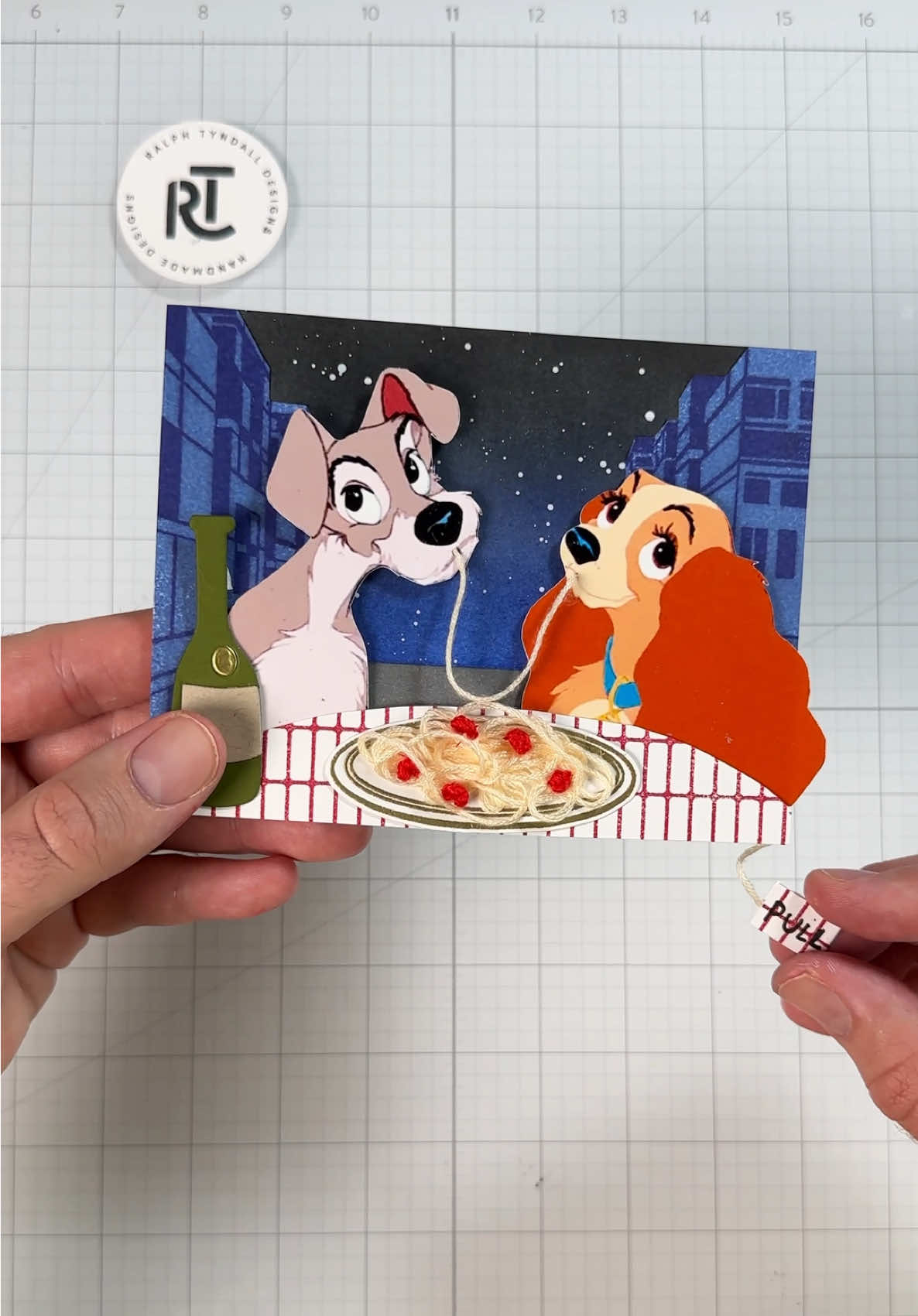 A post by @ralphtyndall on TikTok caption: Carbs have a way of bringing people together 🍝 #cardmaking #asmr #ladyandthetramp #disney #Art #craft 