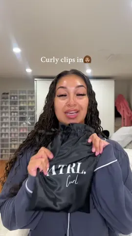 A post by @ on TikTok caption: this is going to be my GO TO summer hair LOL😍 I only wet my hair to match it but imagine it fully wet omggg!!!! can’t wait to style these in different ways😌 @Natrlcurl  #curlyclipins #curlyhair #curlyclipinextensions 
