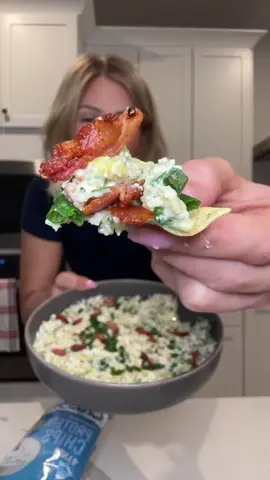 A post by @smallersam_pcos on TikTok caption: Bacon Jalapeño Artichoke Dip✨ the low cal + high protein dip of the Summer!! Here’s the recipe:  -2 jalapeños, chopped (remove the seeds if you don’t like spicy)  -1 can artichoke hearts, drained + chopped.  -1/3c chives  -4 garlic cloves, minced.  -4 pieces center cut bacon, chopped.  -1c Good Culture cottage cheese -1/4c reduced fat sharp cheddar cheese -2tbsp ranch seasoning  Enjoy with Protein Chips and carrot sticks 🥕 #recipe #lunch #mealprep #fiber #caloriedeficit #easyrecipe #pcos #mom #dip #summer #bacon #cheese #protein #healthy #asmr