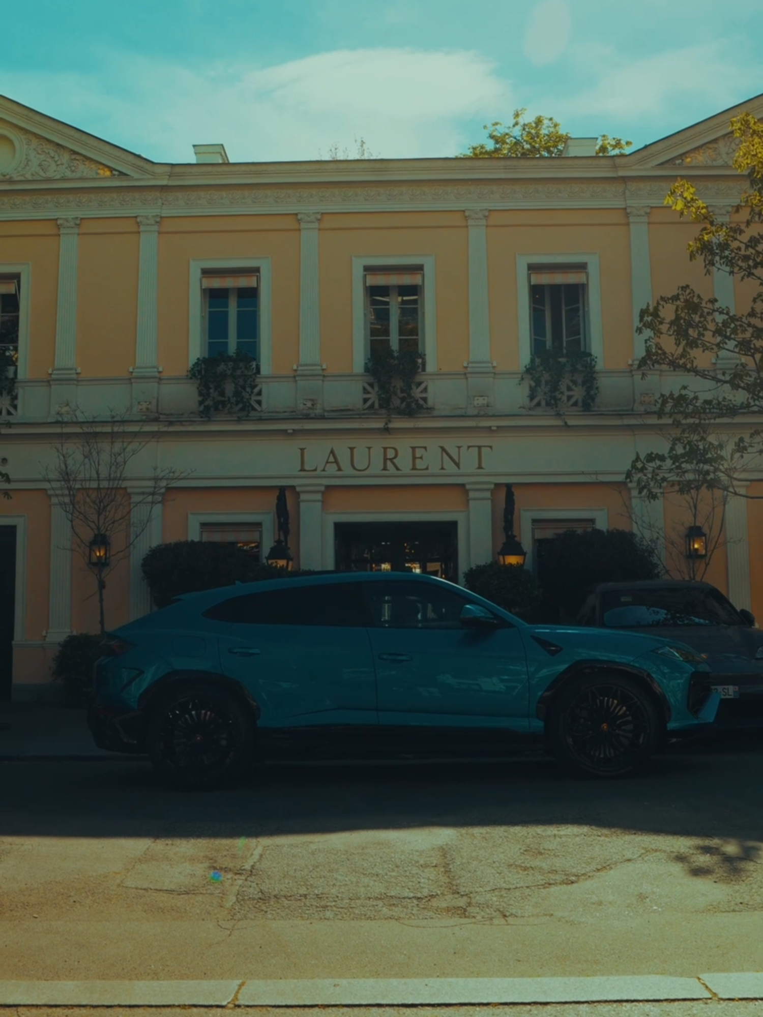 A post by @lamborghini on TikTok caption: From morning traffic to midnight lights, Urus SE transforms with the city, becoming part of its rhythm thanks to its dual nature. #Lamborghini #UrusSE