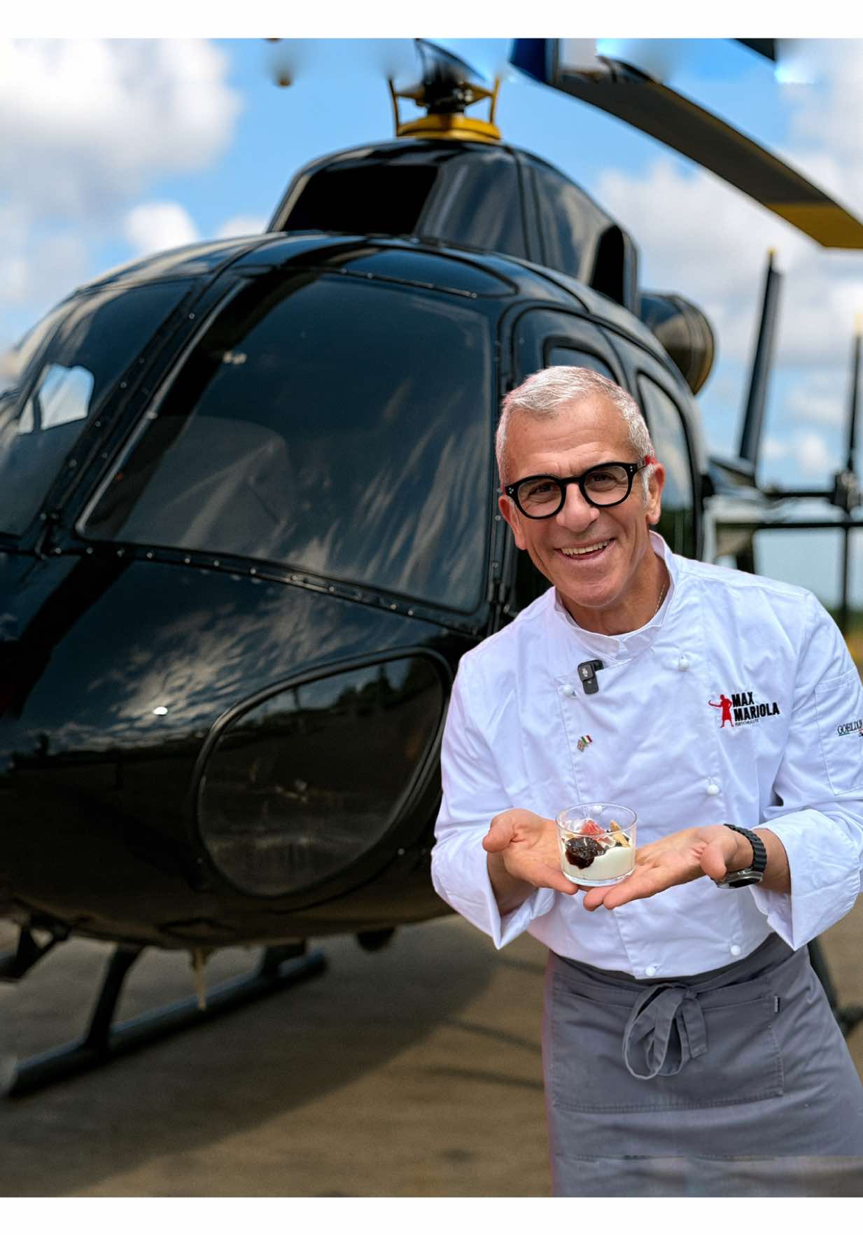A post by @chefmaxmariola on TikTok caption: 🎂 Oggi a Milano iniziano i festeggiamenti per il compleanno del Re d'Inghilterra...e io ancora non ci credo di averlo incontrato davvero!  È successo durante l'UK-Emilia Romagna Festival. Per arrivarci? Quasi una Mission Impossible...ho preso pure un elicottero! 😅 Ma alla fine ce l'ho fatta, e ho servito un piatto con le nostre eccellenze a Sua Maestà 👑 Un momento unico. Da film. Che dite...sono credibile come "Chef" segreto? 😂 #chefmaxmariola #maxmariolacucinapervoi #thesoundoflove #missionimpossible #KingsBirthday #cucinaitaliana #fyp 