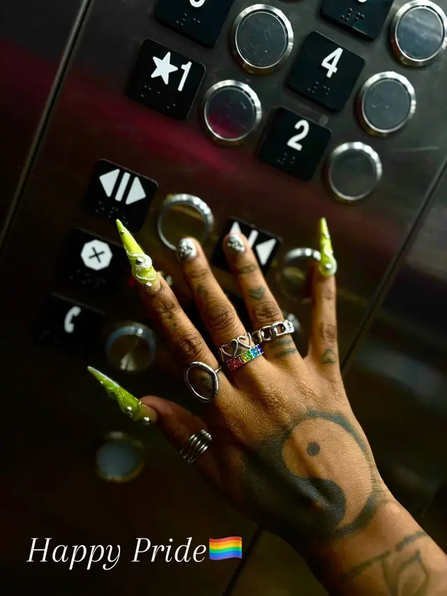 A post by @thekharmalou on TikTok caption: 🫣🙃👩🏾‍❤️‍💋‍👩🏽  Been a proud lesbii since ‘96 🤭  #wlw #pride #Houstonpride #wlwtiktok #fyp #nails #nailsoftiktok #nailart 