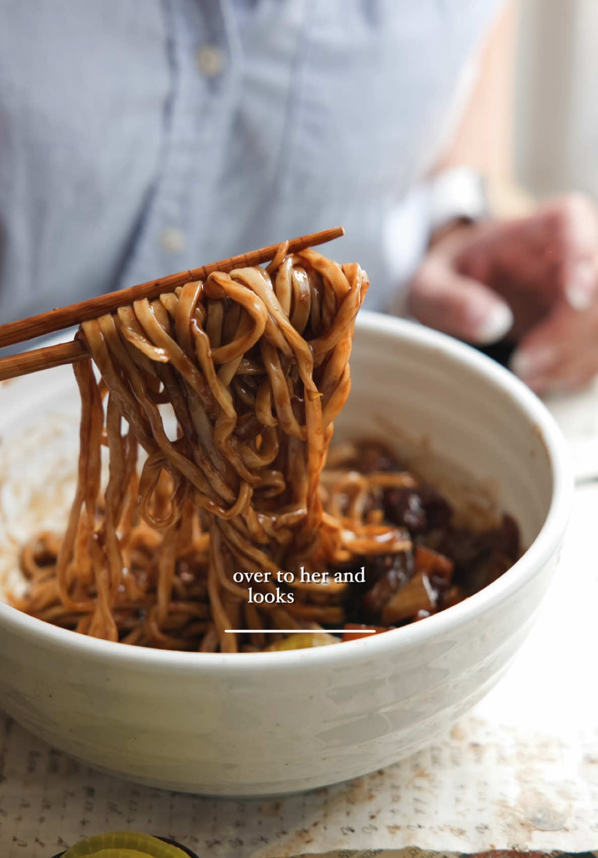A post by @thekoreanvegan on TikTok caption: Happy Father’s Day to all the many folks who play the role of father in a person’s life! If I had to make only ONE dish in the world for Father’s Day, this jjajangmyeon or Korean-Chinese black bean noodle dish would be it! My dad LOVES this dish and the best compliment I’ve ever received on my cooking was the time I made it for him and he declared “You should open a restaurant!” If you want the recipe for these noodles, you know where to find it!  #jjajangmyeon #fathersday #noodles #vegan	