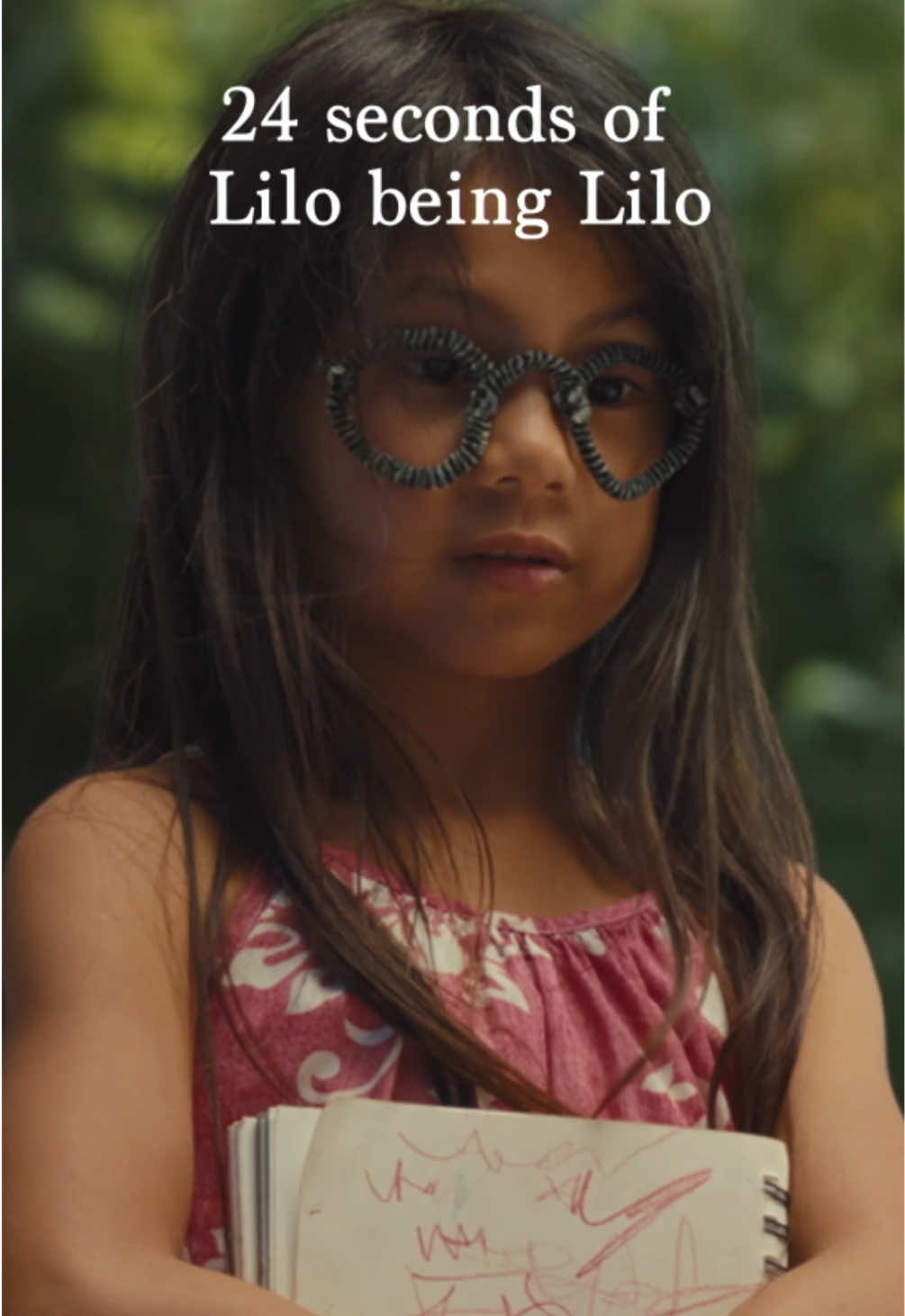 A post by @disneystudios on TikTok caption: just 24 seconds of Lilo being Lilo. #LiloAndStitch is now playing only in theaters! Get tickets now.