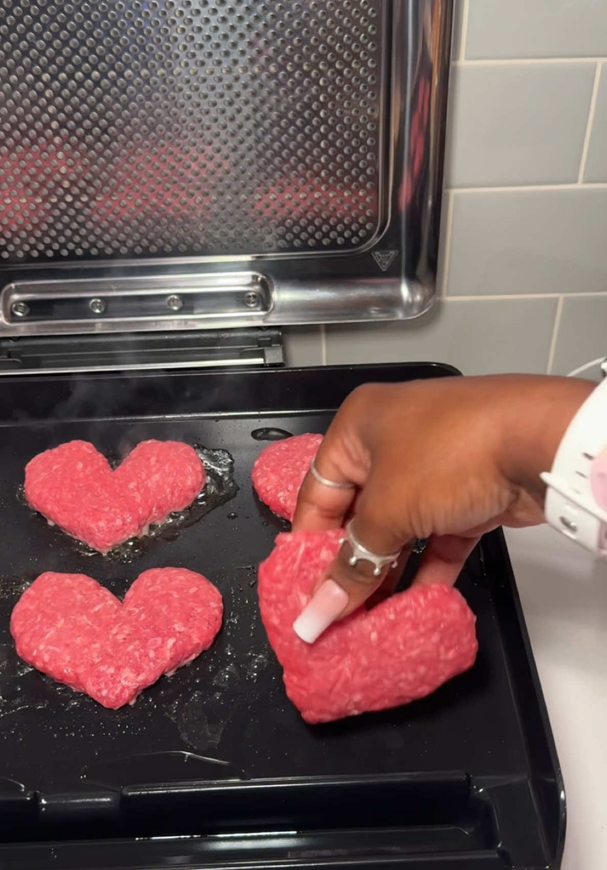 A post by @reignstormpit on TikTok caption: They asked me if I could make them a heart-shaped breakfast with grilled beef, eggs, and waffles. 🧇🥩❤️🐾  - #dogsoftiktok #cookingformydogs #whatifeedmydogs #morningroutine #asmr #asmrcooking #tiktokdogs #petsoftiktok #doglife #puppylife #tiktokcooks #reignstormpit #easyrecipe #relaxing #healthyrecipes #viral 