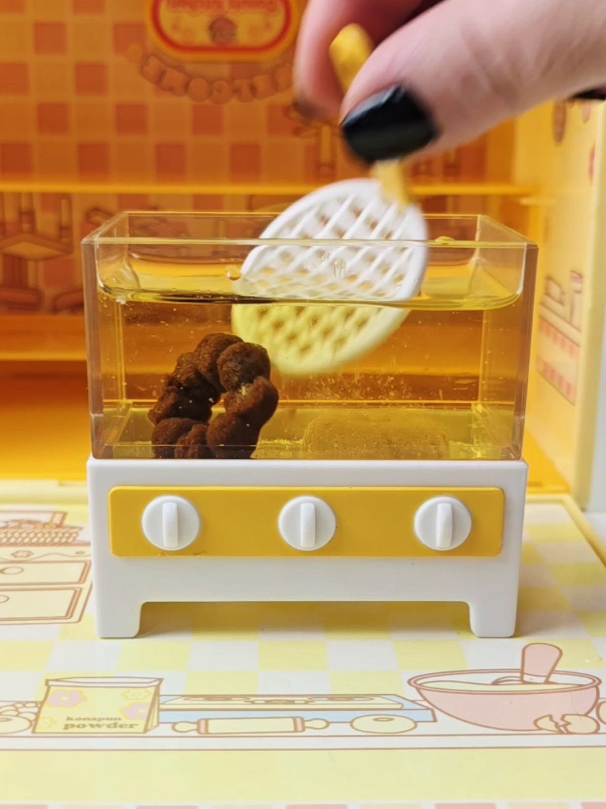 A post by @asmrplayroom on TikTok caption: Frying up some tiny donuts in my 2008 Konapun Donut Kitchen!  #asmr #konapun #nostalgia #rrcherrypie #donut