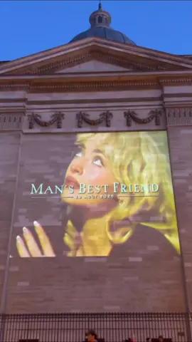 A post by @teamsabrina on TikTok caption: barking at the #mansbestfriend projections in London, Paris, and São Paulo 🐾 #sabrinacarpenter #teamsabrina 
