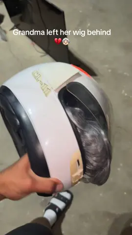 A post by @adrian_peru on TikTok caption: She wanted to look “cool” riding on a motorcycle for her crush 🏍️💔😓 #Wig #GrandmaCrush #Bald #WigFail #Helmet #RetirementHome #PatchyHead 