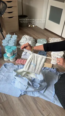 A post by @samanthaalfred on TikTok caption: Pack my bridesmaids goodie bags for my “last toast on the coast” themed bachelorette 🥥✨🤍🧺 #bachelorette #bacheloretteparty #bridemaidsgifts #lasttoastonthecoast #bachelorettepartytheme #bridetobe #bachelorready #weddingtok #bridetok 