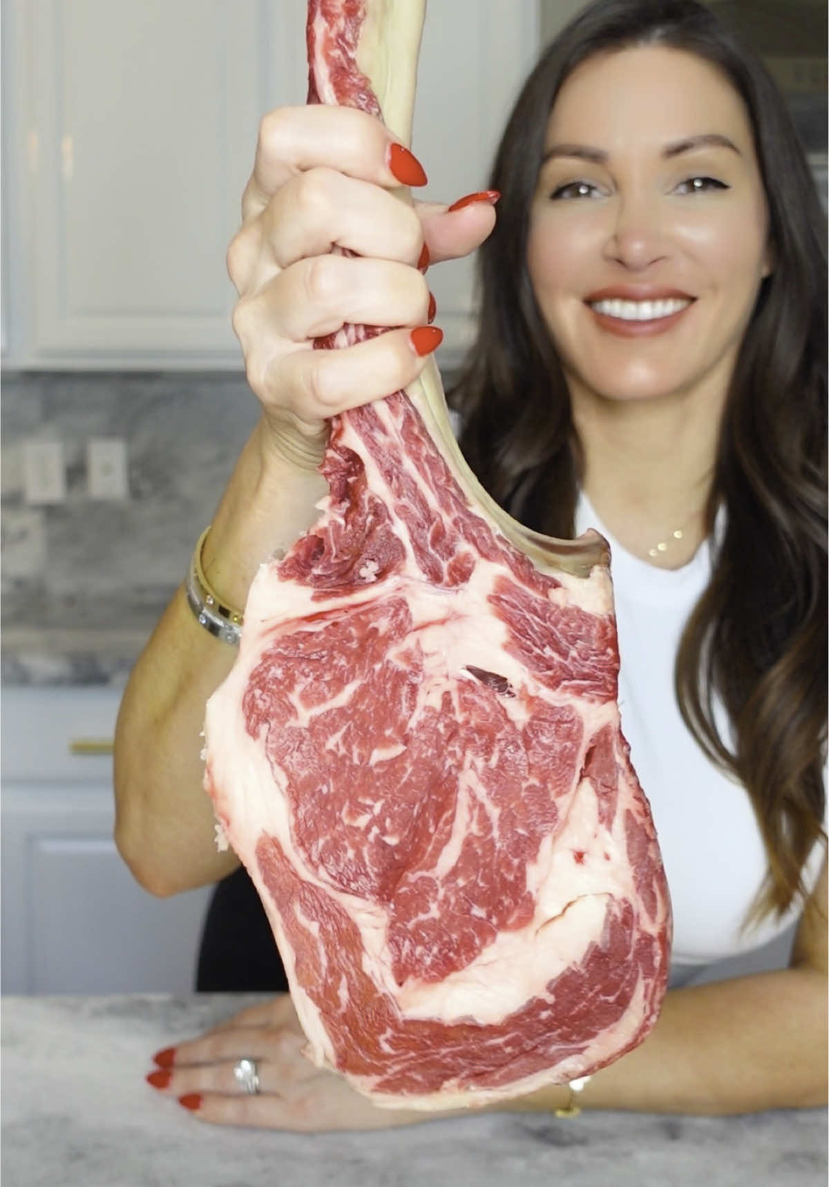 A post by @chefgenevieve on TikTok caption: Tomahawk feast 🥩🔥 Reverse-seared tomahawk, crispy & creamy potatoes, honey-roasted carrots, prosciutto-wrapped asparagus, and a fresh Caprese, plus a trio of sauces. Full recipes below ⬇️ @Cafe Casino  Make it for the dad in your life or anyone who deserves a serious steak night. 🥂 Which side are you grabbing first?  #FathersDayDinner #TomahawkSteak #ReverseSear #SteakNight #cafecasinopartner  Tomahawk: 1 tomahawk steak Salt  Pepper  Olive oil Coat Tomahawk with olive oil salt and pepper place on a rack on a sheet pan and bake in the oven at 225° until the internal reaches 115° (about one hour and 30 minute). Cover and rest for 15 minutes. Grill on high heat until a crust has formed about 2 minutes per side. Rest for 5 minutes. Slice meat off bone then slice meat in smaller sections. Present alongside the tomahawk bone.  Creamy potatoes: 1 large russet potato 1 stick butter 1/2 cup half and half Salt tt Peel, dice and boil potatoes in heavily salted water until fork tender. Pass though a fine mesh sieve. Warm butter with half-and-half until butter is melted . Pour into the potatoes and mix well. Crispy Potatoes: 1 large russet potato  1/4 cup beef tallow or duck fat or avocado oil  Optional herbs (thyme, parsley or rosemary) Peel, dice and boil potatoes in heavily salted water until fork tender. Place on a sheet pan and cover with fat of choice. Roast in a 425° oven for 40 minutes flipping halfway. Garnish with fresh herbs  Honey Roasted Carrots: 1 bunch heirloom carrots Olive oil Honey Salt and pepper tt Toss carrots in olive oil, honey, and salt and pepper and roast in the oven until fork tender  Prosciutto Wrapped Asparagus: One bunch of asparagus  3 to 4 pieces of prosciutto  Olive oil Pepper tt  Trim asparagus. Sliced prosciutto in half lengthwise. Roll 3-4 asparagus onto prosciutto. Drizzle on olive oil and season with pepper only. Caprese Salad: Burrata - 1 ball 3 heirloom tomatoes Sliced mozarella log Fresh basil leaves Baby tomatoes (optional) Balsamic glaze Salt and pepper tt Place burrata in center of your plate and break open. Alternate sliced tomatoes with sliced mozzarella and basil leaves. Drizzle on balsamic glaze and sprinkle on salt and pepper. Chimichurri Compound butter 1 stick of butter, room temperature  1/4 cup fresh parsley, minced 2 tbsp fresh oregano, minced 2 cloves garlic, grated 2 tbsp red wine vinegar Salt tt Mix all ingredients together Horseradish sauce: 1/2 cup sour cream 1 tbsp mayo 1 tbsp heavy cream 1-2 tbsp horseradish  Salt Chive, garnish Mix all ingredients together and garnished with chive Red Wine Demi Glace  4 packs beef Demi glace reduction sauce 1/4 cup red wine Combine in a saucepan and reduce until thickened.  Enjoy!