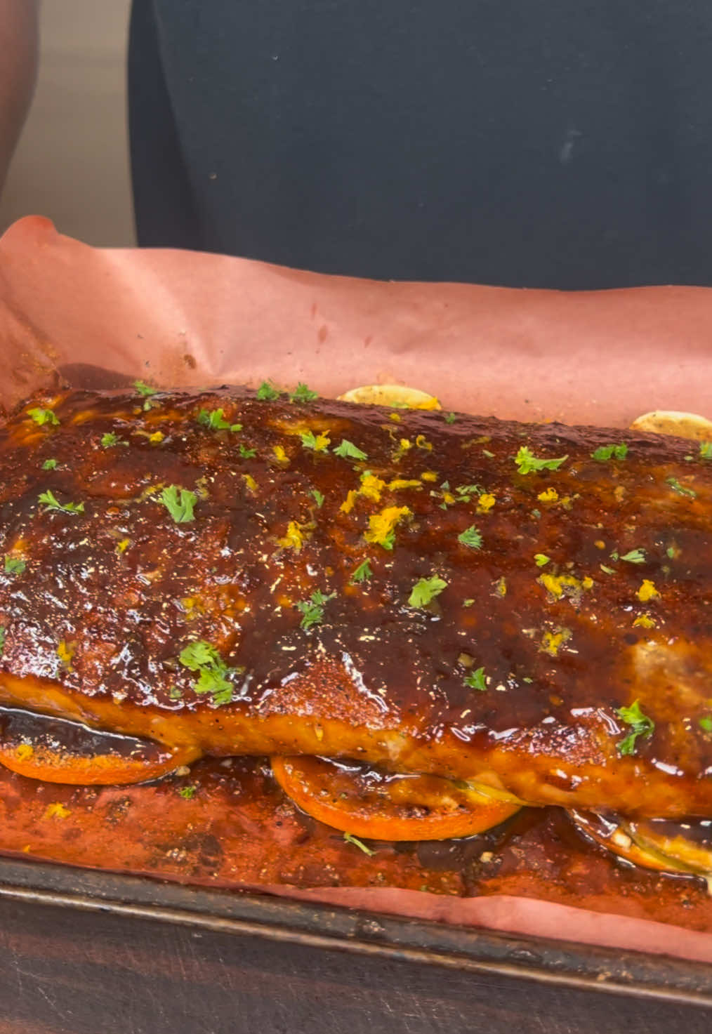 A post by @eatwitzo on TikTok caption: Welcome back to the smoker series! This is how to make the easiest summer salmon recipe using the @webergrills Searwood Wood Pellet Grill  #webergrills #woodpellet 