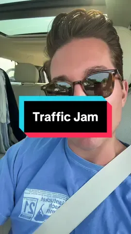 A post by @ericgoldie on TikTok caption: A traffic jam is a lot more fun if you pretend it’s just a parade with no floats. #thehamptons #southampton #newyorkers #couplescomedy #marriedlife 