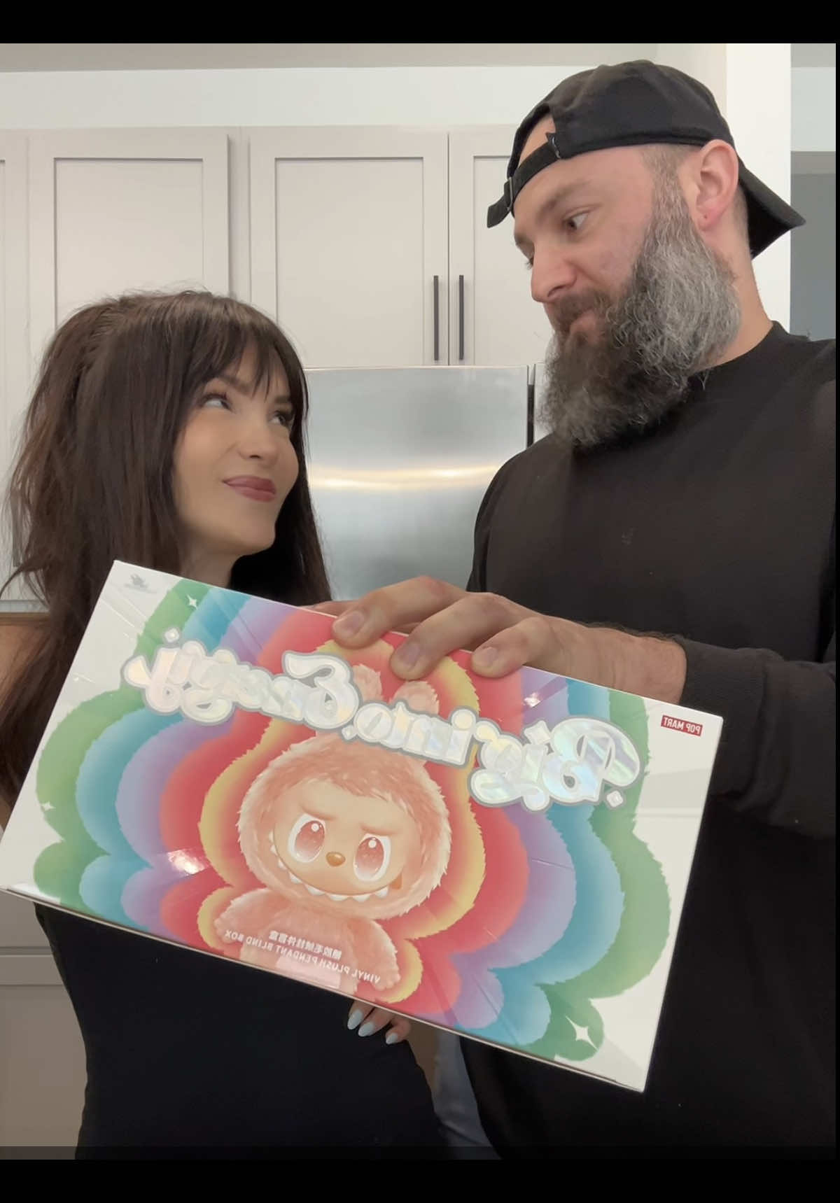A post by @beingjustjohn on TikTok caption: Labubu big into energy unboxing @Tori Kahhat @POP MART US 