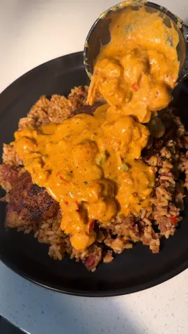 A post by @cookingwithdestiny_ on TikTok caption: Blackened catfish over dirty rice 🤤