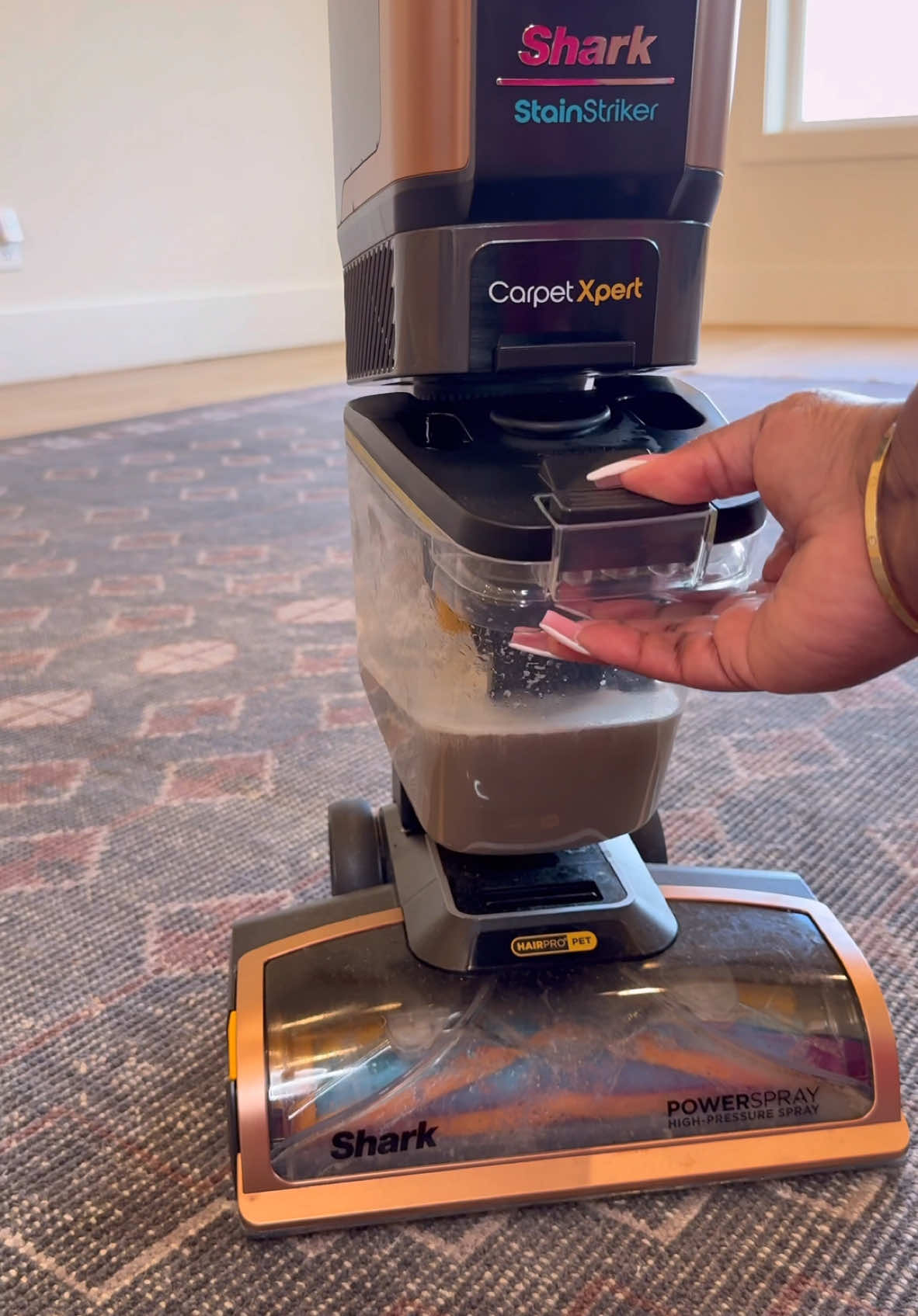 A post by @operation_niki on TikTok caption: If you have kids, pets, or just life happening on your carpets 😅… this is your sign to deep clean 👏🏽 #SharkPartner I’ve been using the @Shark Home CarpetXpert and I’m actually shocked at how much it pulls up. The built-in wand makes it super easy to spot-treat messes on stairs, rugs, or the places you swore were “clean enough.” My home already feels fresher. #SharkCarpetXpert #HomeReset #DeepCleanDay