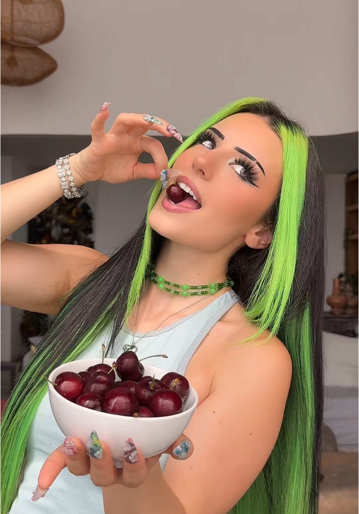 A post by @di1araa.s on TikTok caption: Anzeige | Can you guess the lipgloss color from the fruit or flower? 🥹😍💚@maybelline de #maybelline #makeup #lifterglaze