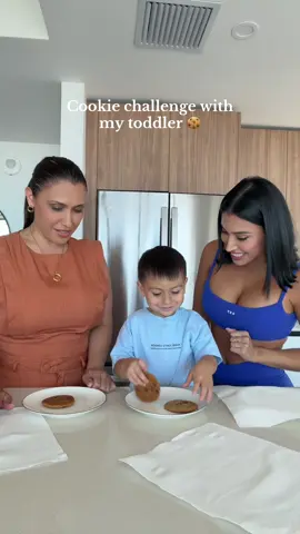 A post by @alexbravoxo on TikTok caption: Cookie challenge with my toddler 🍪😂 @Alexox0  #fyp #explorepage #momsoftiktok #toddlermom #cookiechallange #cookiechallengewithkids #momsbelike 