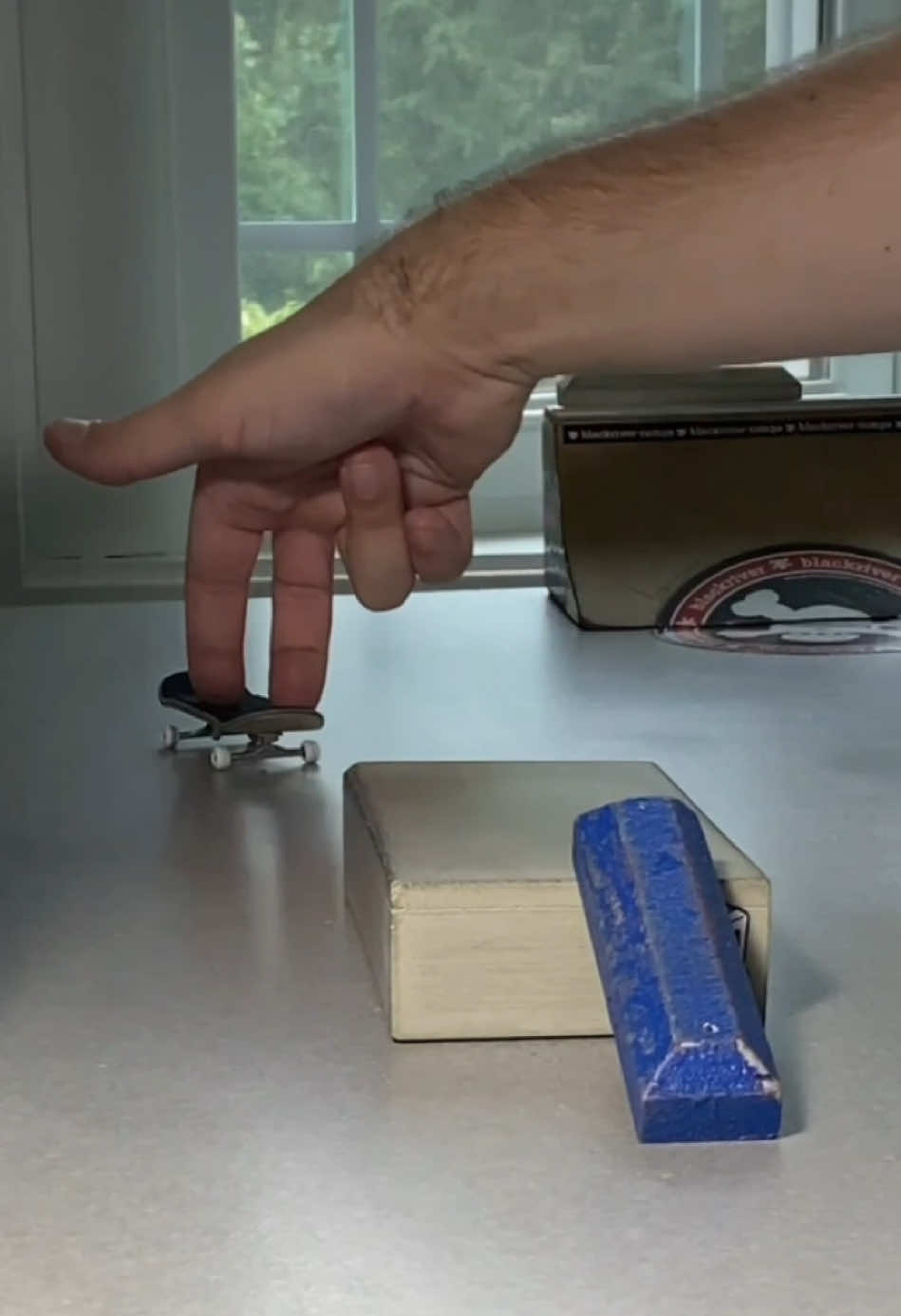 A post by @stonedboarder on TikTok caption: Satisfying 🔂 #fingerboard #skatelife #fingerskate #sk8 #fingerboarding #skateclips #profingerboard #fingerboardtricks #skaters #techdeck #fingerboards 