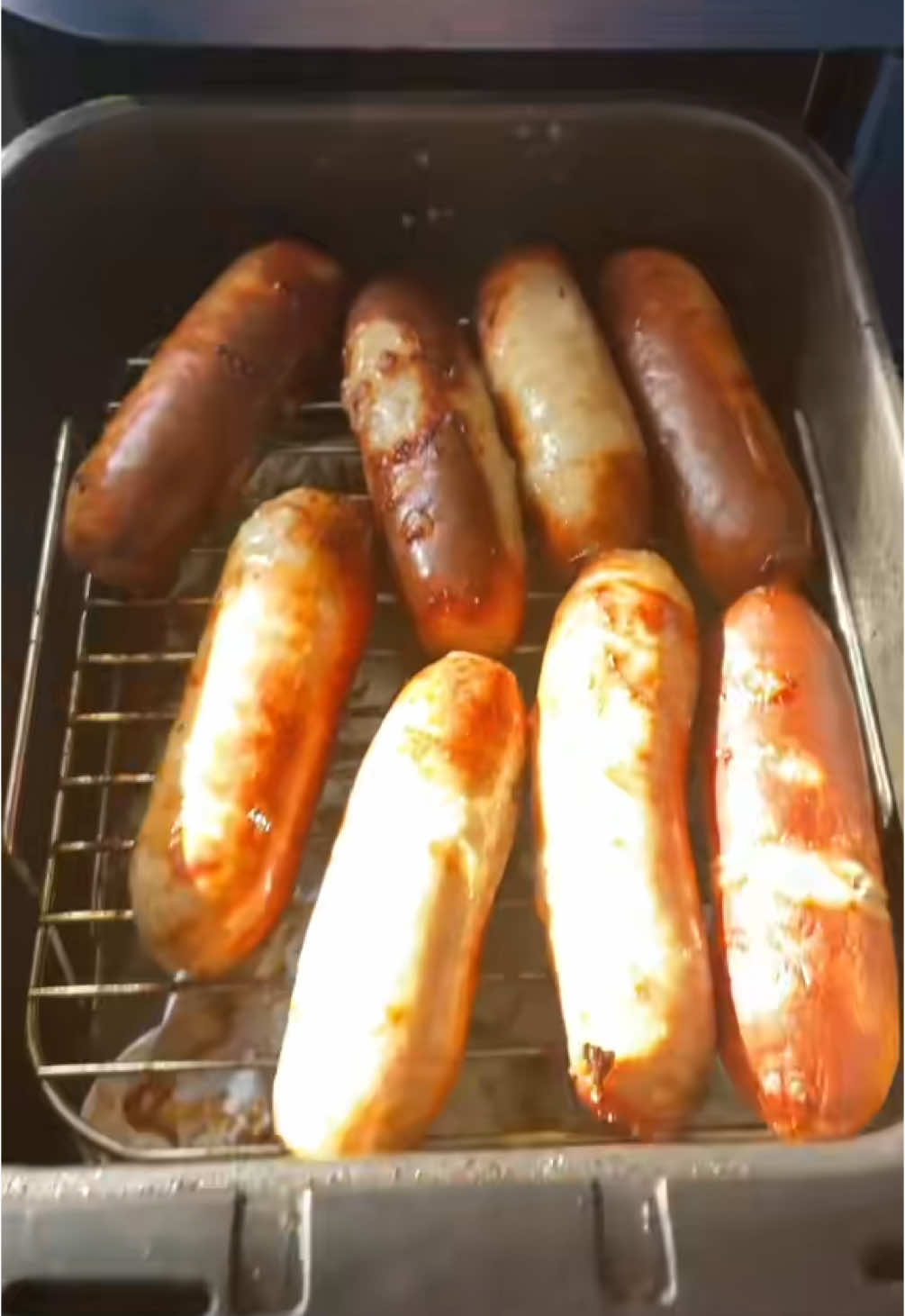 A post by @daddymaycooks on TikTok caption: #onthisday a classic! So many people got upset about the raw bacon on the sausages. Not sure why 🤔 #daddymay #mayfamily #airfryer #dinner