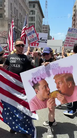 A post by @alfredo_lewis on TikTok caption: Taylor Swift Made Me Do It. No Kings. #fyp #nokings #taylorswift #losangeles #taco #protectthedolls #immigrant #wethepeople 