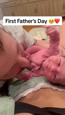 A post by @jaxwritessongs on TikTok caption: He waited 9 months for this moment. 🥹❤️                                                  Now I get to watch our daughter fall in love with you the way I did…Happy 1st Father’s Day to the greatest father in the world. We love you so much. @Husband of a TikToker #FathersDay #dad #fyp #baby 