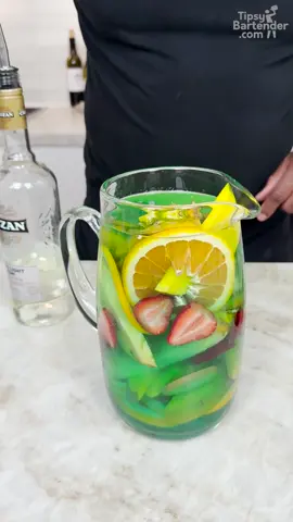 A post by @realtipsybartender on TikTok caption: Smurf Blue Sangria #cocktails #wine