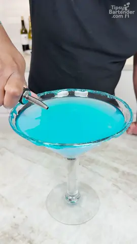 A post by @realtipsybartender on TikTok caption: Berry Blue Jolly Rancher Martini #cocktails