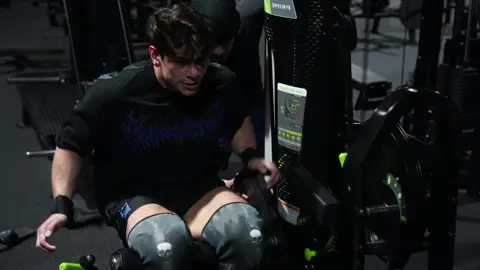 A post by @clarkybateman on TikTok caption: Legs with the OG  quadfather was a top 5 experience. Literally rewatching this during legs rn to give myself the vicarious adrenaline boost 😭😭